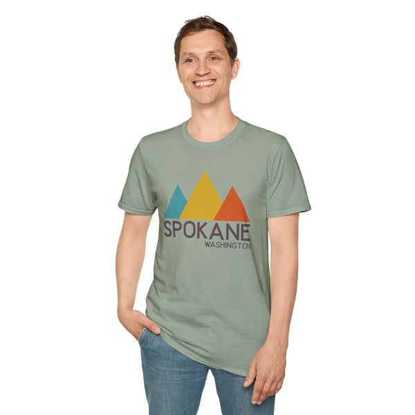 Modern Peaks Spokane T Shirt worn by a smiling man showcasing urban meets mountain style.