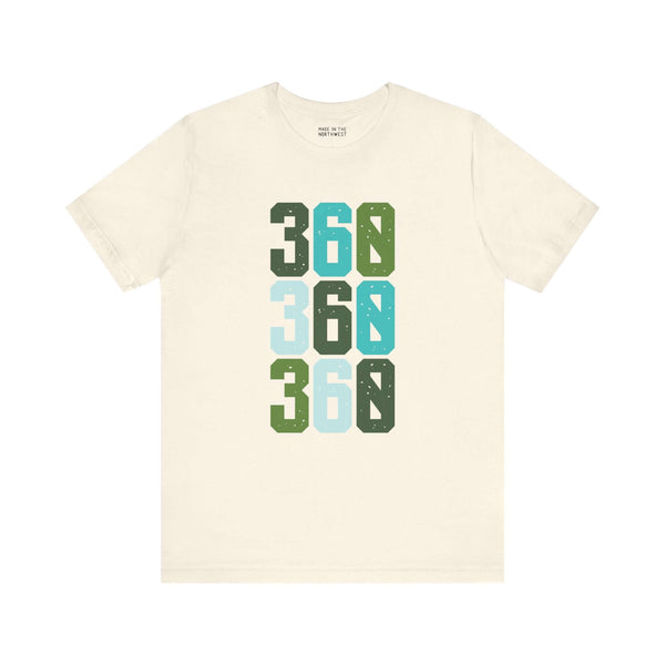 Cream t-shirt featuring "360" in three colorful rows, celebrating Pacific Northwest style and area code pride.