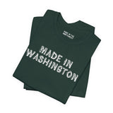 Premium soft tee in dark green featuring 'Made in Washington' log font, ideal for Pacific Northwest pride.