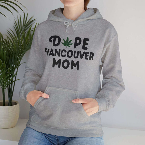 Woman wearing "Dope Vancouver Mom" hoodie with marijuana leaf design, showcasing cool mother style from Washington state.