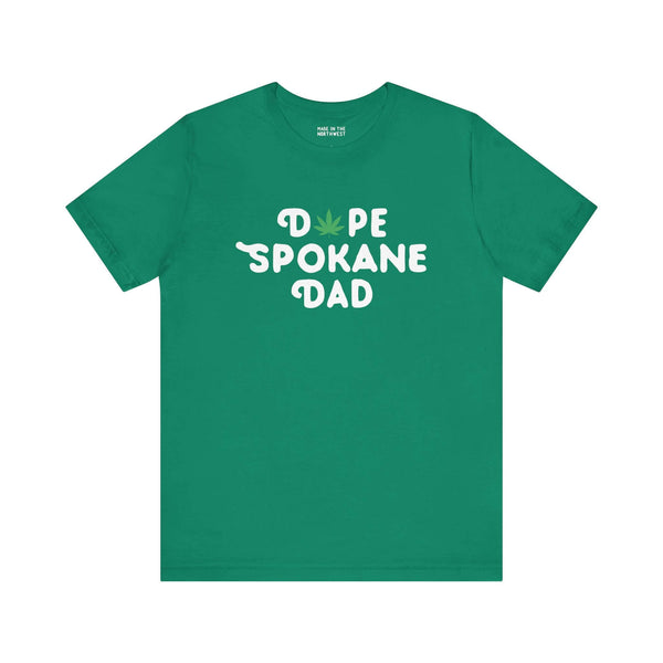 Green "Dope Spokane Dad" soft tee with marijuana leaf design, perfect for stylish Washington state dads.