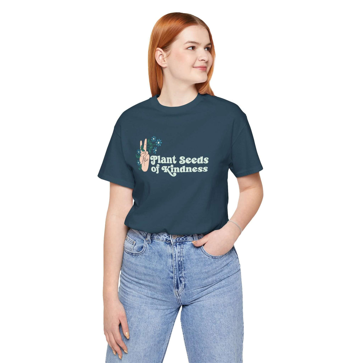 Model wearing Plant Seeds of Kindness premium tee featuring a peace sign and flowers design.