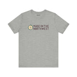 Gray tee with 'Made in the Northwest' logo and compass design, perfect for showcasing Pacific Northwest pride and spirit.