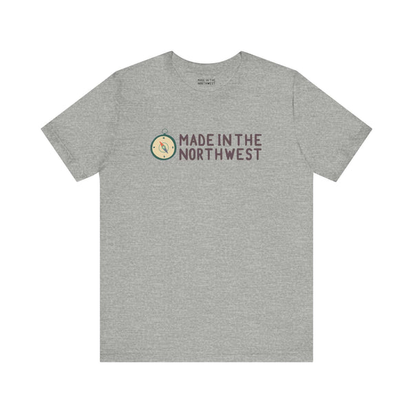 Gray tee with 'Made in the Northwest' logo and compass design, perfect for showcasing Pacific Northwest pride and spirit.