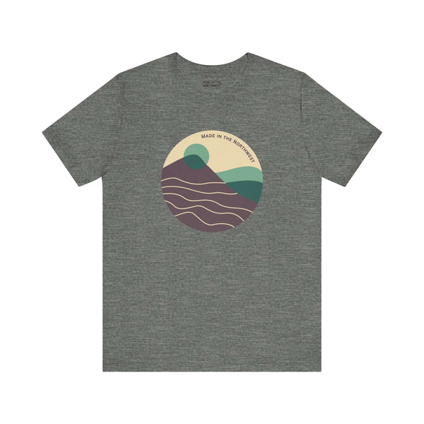 Pacific Peaks Modern Circle Soft Tee with mountain scene design in green colorway, inspired by the Pacific Northwest.