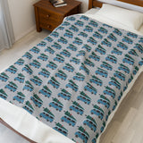 Camper van blanket featuring vintage Volkswagen buses with Christmas trees for a cozy holiday road trip.
