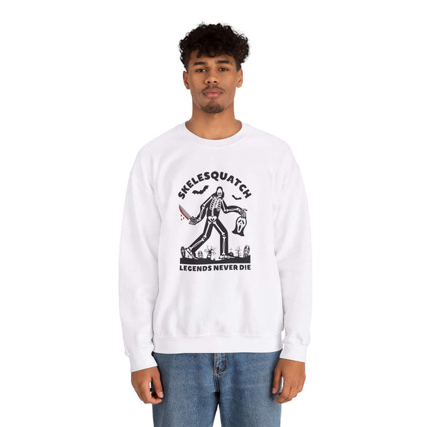 Skelesquatch Halloween sweatshirt with skeleton sasquatch design, featuring a graveyard and Scream mask. Perfect for Halloween.