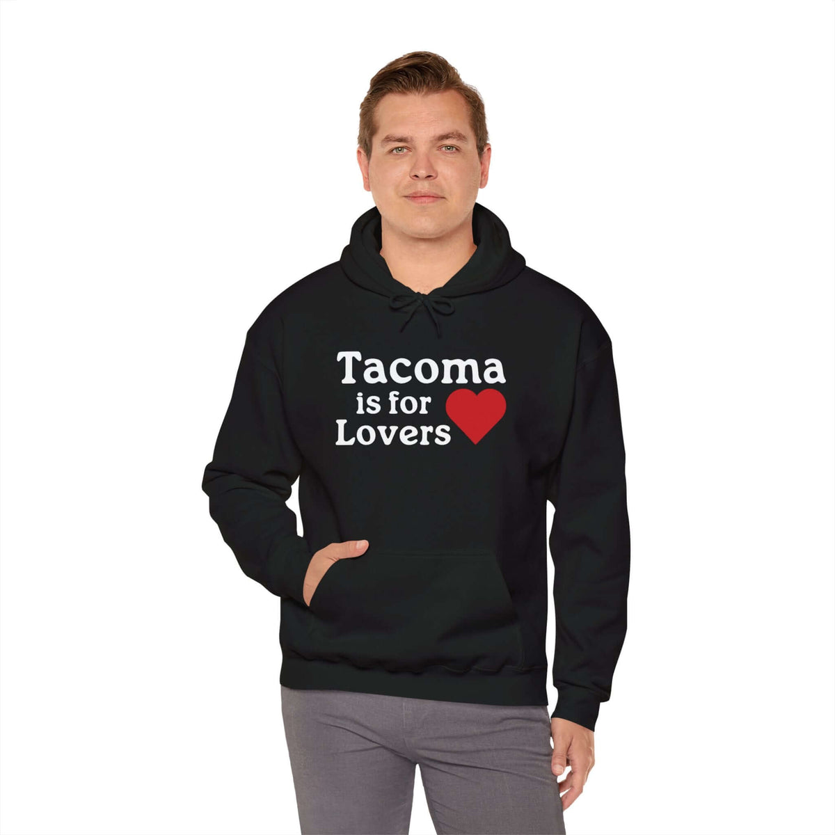 Man wearing a black "Tacoma is for Lovers" hoodie with red heart design.