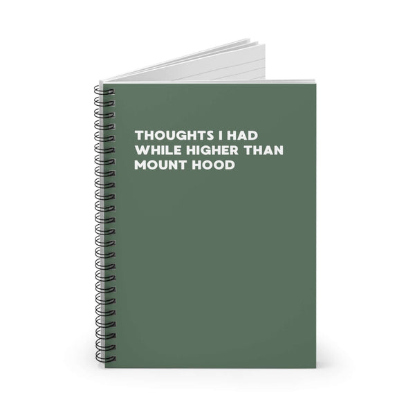 Spiral notebook with the title 'Thoughts I Had While Higher Than Mount Hood' on a green cover.