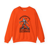 Orange Halloween sweatshirt featuring Skelesquatch with a trick-or-treat bucket, graveyard scene, and text 