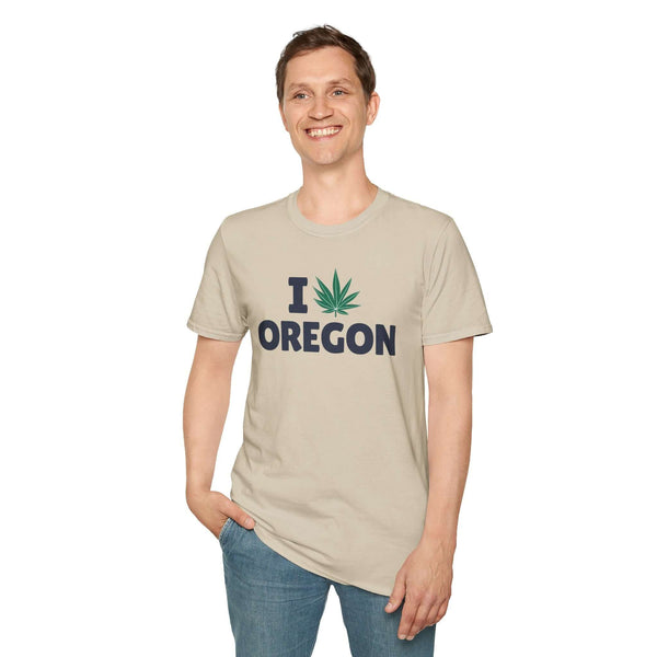 I Marijuana Oregon T Shirt worn by a smiling man, featuring a graphic of Oregon with a marijuana leaf, casual style.