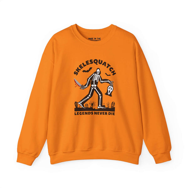 Skelesquatch Halloween sweatshirt featuring a skeleton Bigfoot with a knife and iconic Scream mask design.
