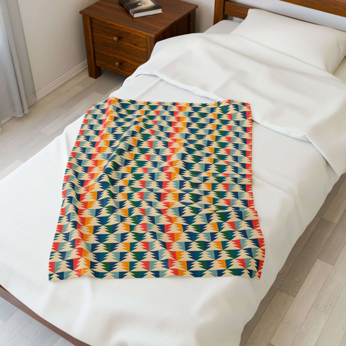 Apres Evergreen in the PNW Retro Lightweight Cozy Blanket on a bed, showcasing colorful pine tree design.