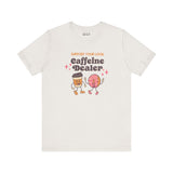 Support Your Local Caffeine Dealer premium soft tee featuring playful coffee and donut characters.