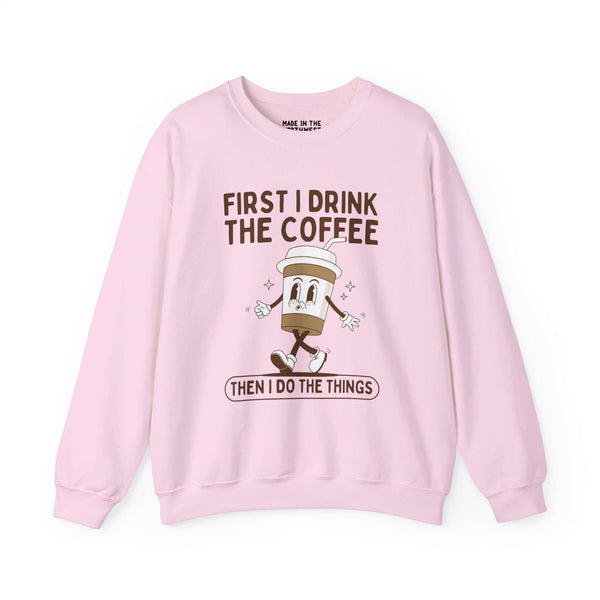 Pink sweatshirt with the text "First I Drink the Coffee Then I Do the Things" and a cute coffee cup graphic.