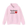 Pink "Spokane is for Lovers" hoodie with a heart symbol, celebrating the beauty and spirit of Spokane.