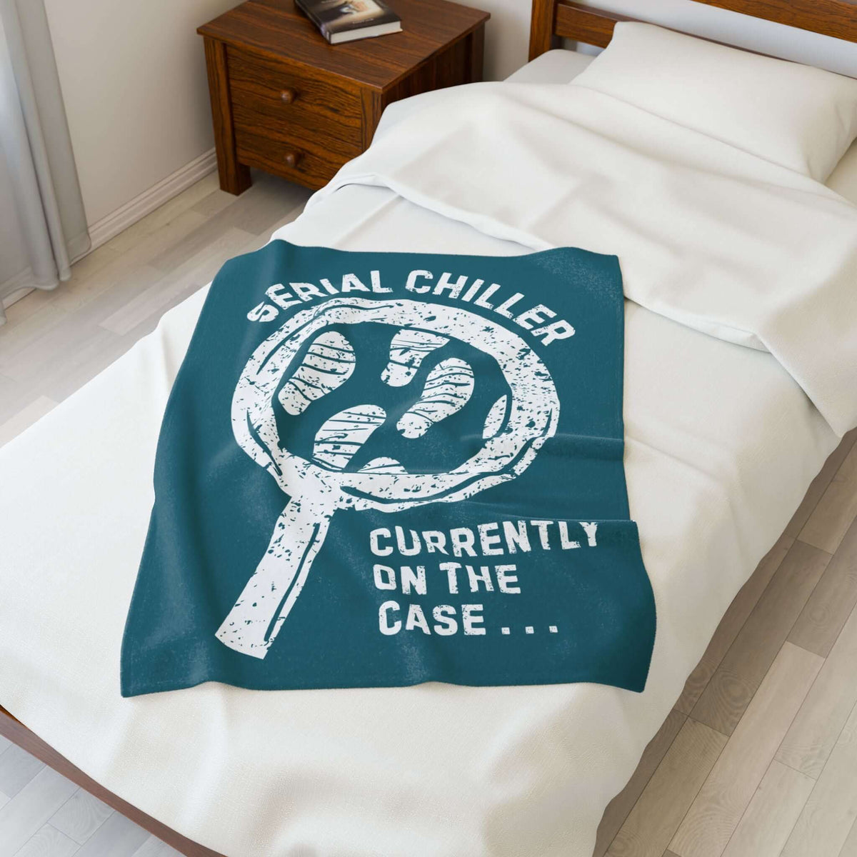 Serial Chiller True Crime Lightweight Cozy Blanket on a bed, perfect for true crime fans and cozy nights in.