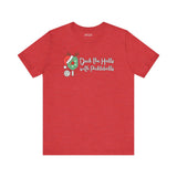Deck the Halls with Pickleballs T Shirt in festive red with playful design elements.
