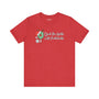 Deck the Halls with Pickleballs T Shirt in festive red with playful design elements.
