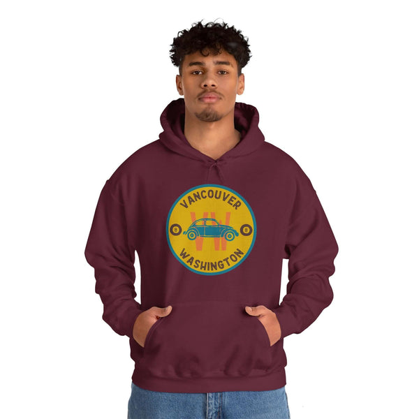 Man wearing Vancouver VW Classics Beetle hoodie with vibrant round Beetle design on burgundy sweatshirt.