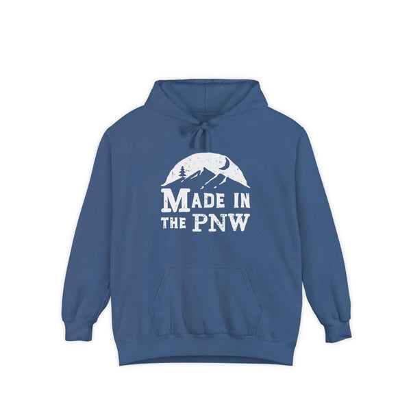 Made in the PNW hoodie in blue with mountain graphic, symbolizing Pacific Northwest outdoor style.