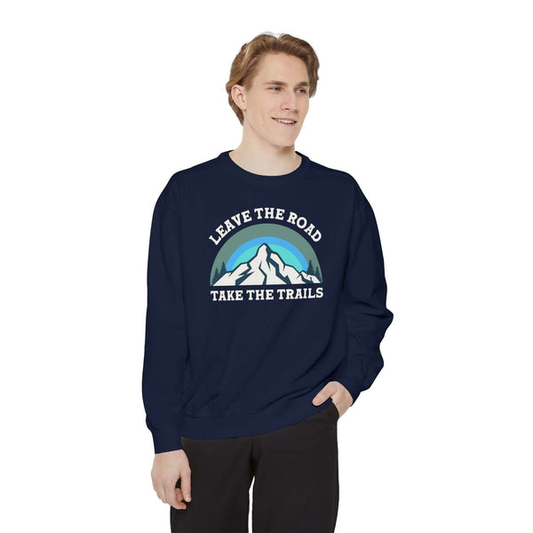 Leave the Road Take the Trails Sweatshirt worn by a man, featuring a mountain design and inspiring phrase.