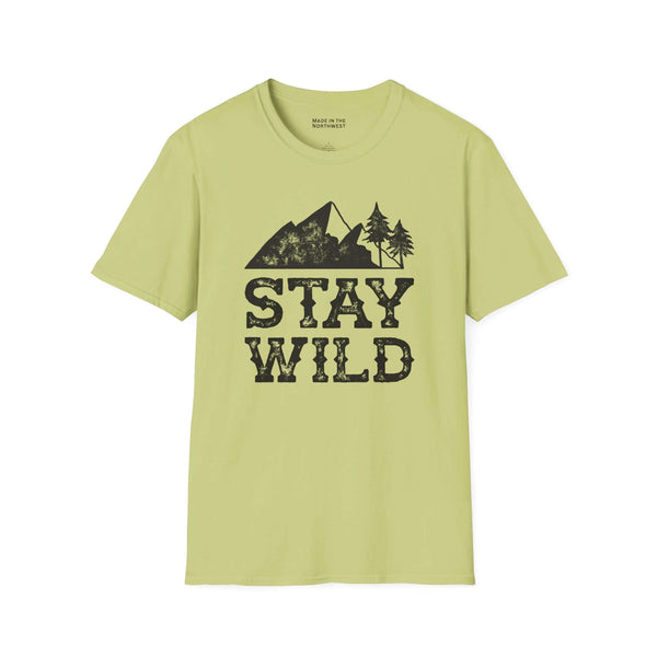 Stay Wild T Shirt featuring outdoor mountain and tree design on a light green background.