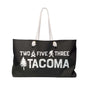 Two Five Three Roots Tacoma Weekender Bag featuring axe, Bigfoot, and tree design for PNW trips.