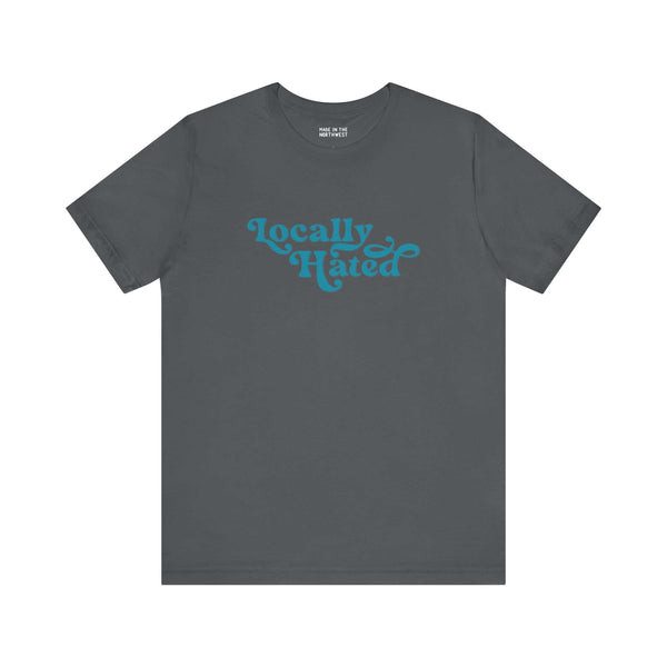 Charcoal "Locally Hated" soft tee with bold blue cursive font, Pacific Northwest inspired, perfect for a distinctive look.