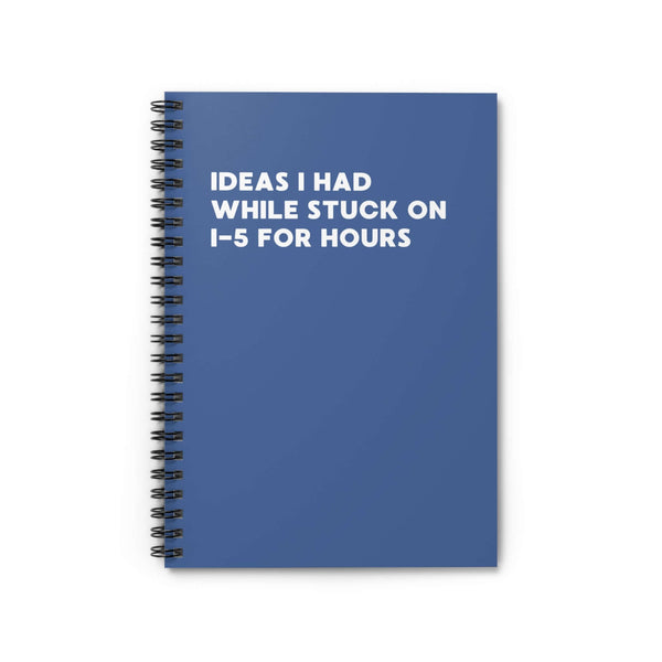 Blue spiral notebook titled 'Ideas I Had While Stuck on I-5 for Hours' with a minimalist design.