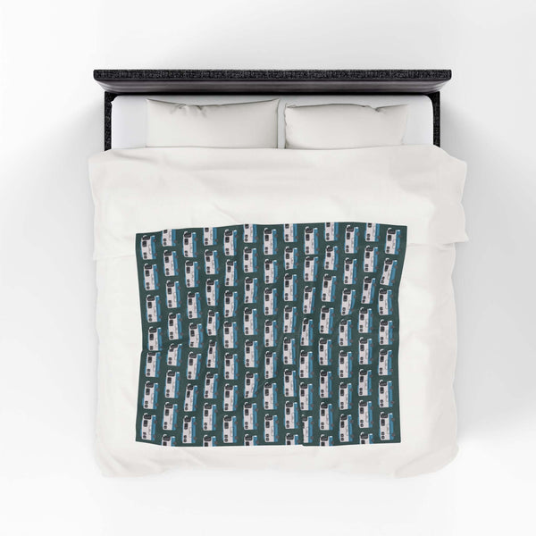 Highway Hideaway Class A Motorhome Lightweight Cozy Blanket displayed on a bed, featuring a repeat motorhome pattern.