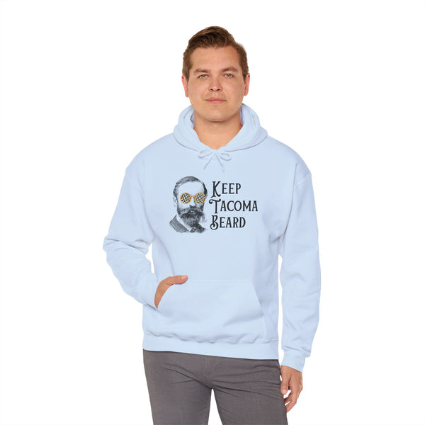Man wearing light blue Keep Tacoma Beard hoodie with vintage bearded graphic and sunglasses, showcasing Tacoma pride.