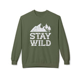 Stay Wild sweatshirt featuring faded mountain and trees graphic on a cozy crewneck in earthy green color.