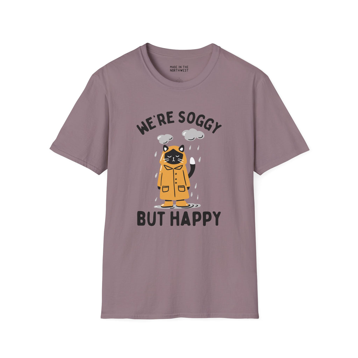We're Soggy But Happy t-shirt featuring a drenched cat in a raincoat, perfect for embracing rainy days.
