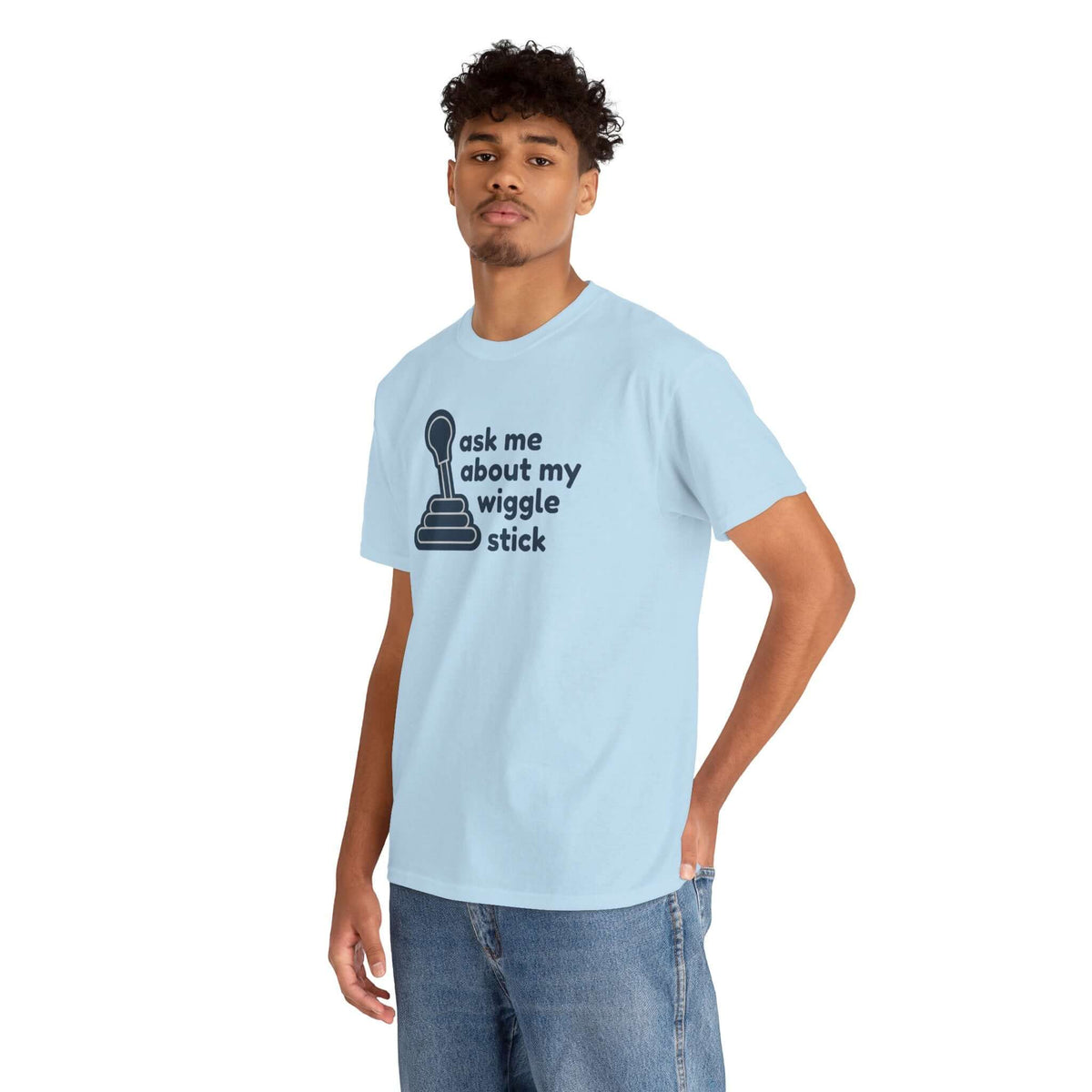 Young man wearing a light blue t-shirt with the phrase 'ask me about my wiggle stick' and a gear shift graphic.