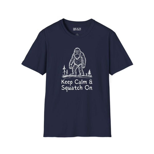 Keep Calm & Squatch On Bigfoot Softstyle T-Shirt in navy, featuring a Sasquatch graphic and forest elements.