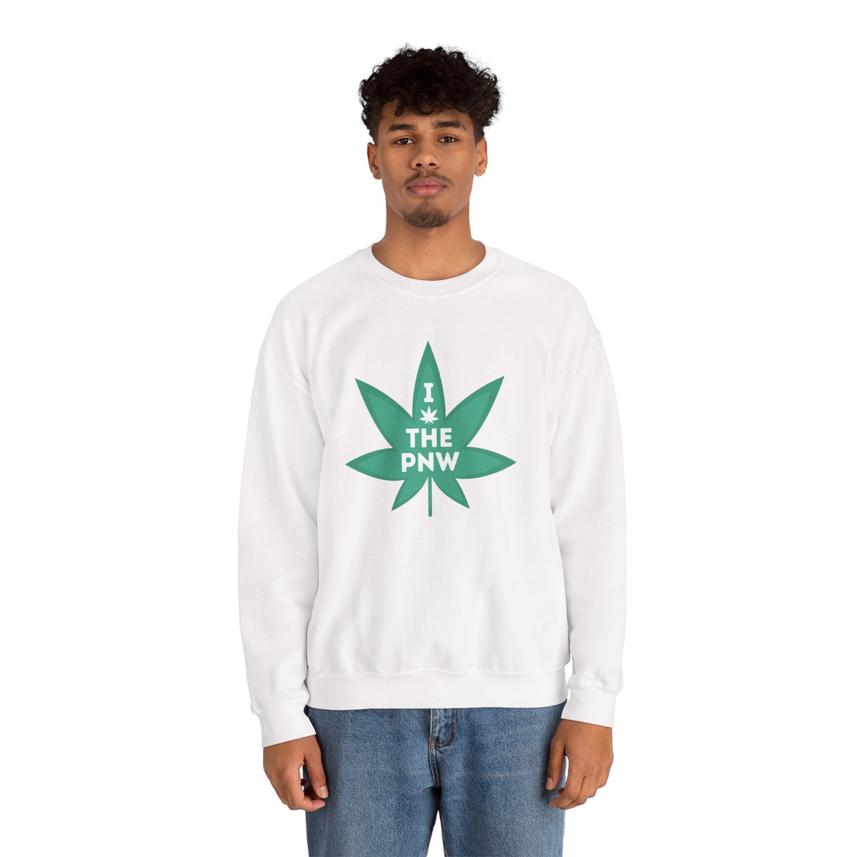 Man wearing a cozy white sweatshirt with a green marijuana leaf graphic that says 'I (Weed) the PNW'.