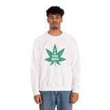 Man wearing a cozy white sweatshirt with a green marijuana leaf graphic that says 'I (Weed) the PNW'.