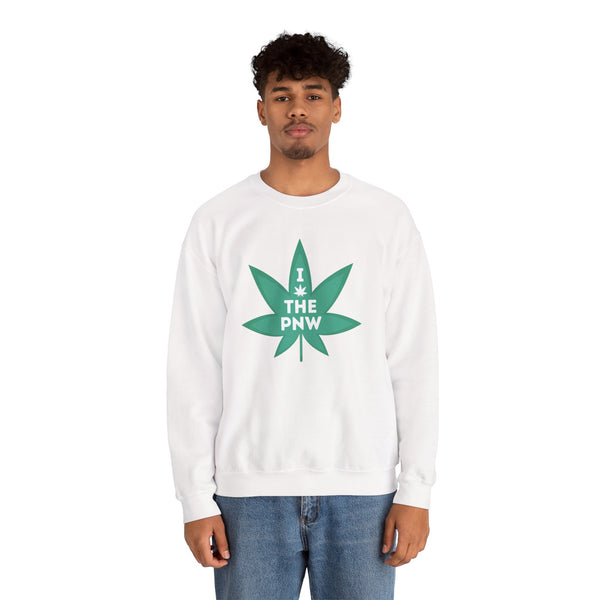 Man wearing a cozy white sweatshirt with a green marijuana leaf graphic that says 'I (Weed) the PNW'.