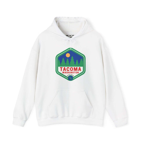 White hoodie with Tacoma Washington retro badge, trees, and sun design, showcasing Northwest outdoor charm.