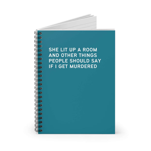 Spiral notebook with the title 'She Lit Up a Room and Other Things People Should Say if I Get Murdered' on the cover.