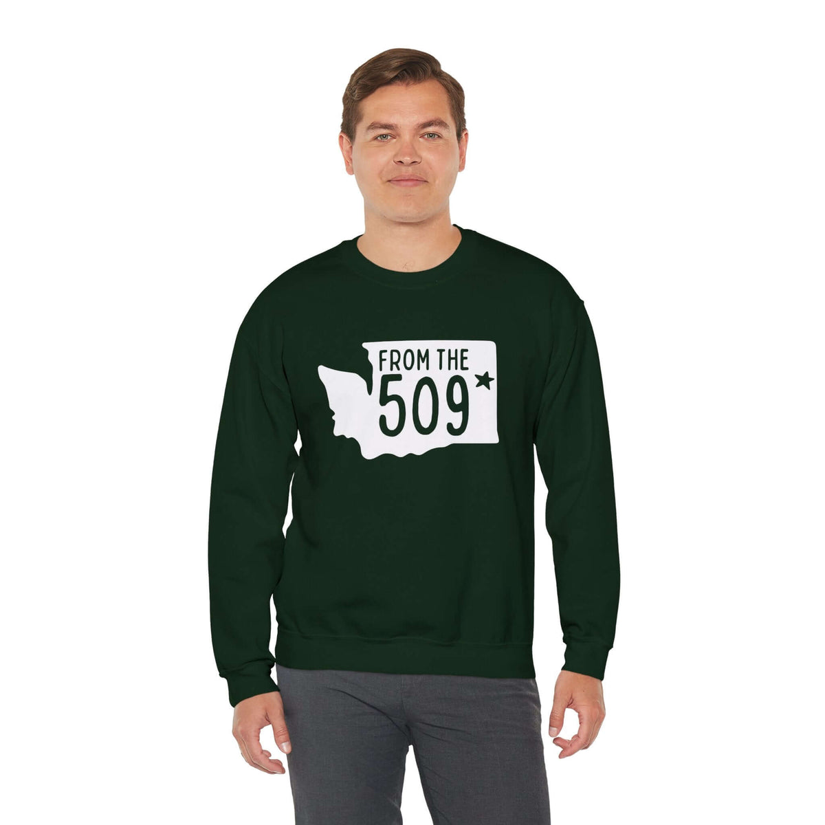 Man wearing "From the 509" sweatshirt with Washington state silhouette and Spokane star, showcasing local pride.