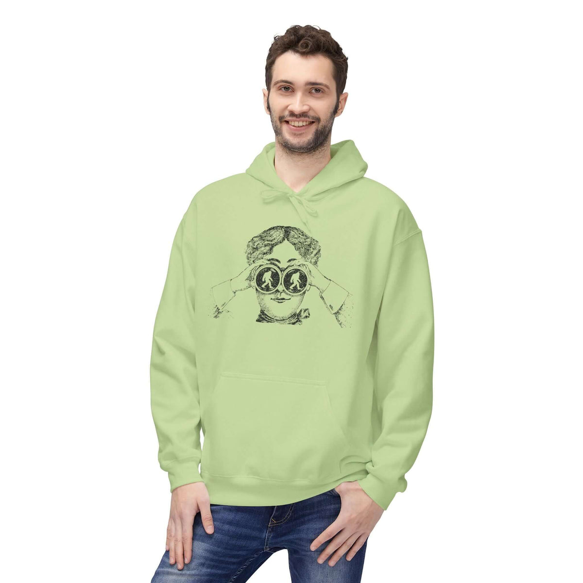 I spy Bigfoot hoodie featuring an explorer in a vintage style illustration wearing binoculars.