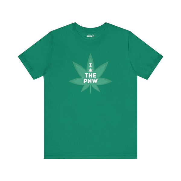 Green soft tee with "I (Weed) the PNW" design featuring a marijuana leaf for Pacific Northwest lovers. Casual, nature-inspired fashion.