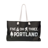 Five Oh Three Roots Portland Weekender Bag with axe and tree design, perfect for adventures.