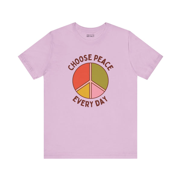 Choose Peace Every Day premium soft tee in light pink with colorful peace symbol design.