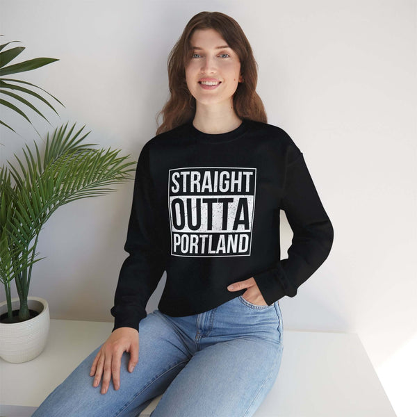 Model wearing a black sweatshirt with 'Straight Outta Portland' graphic, showcasing local pride and streetwear style.