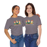 Two women wearing 'Chillin' with My Gnomies' premium soft tees featuring whimsical garden gnomes.