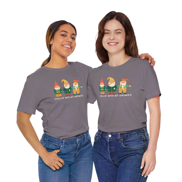 Two women wearing 'Chillin' with My Gnomies' premium soft tees featuring whimsical garden gnomes.
