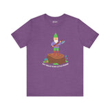Purple soft tee featuring a gnome with an axe, saying 'Say hello to my little friend' on a stump.